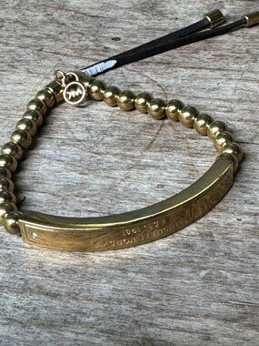 Michael Kors Bracelet Gold Tone Beaded With Engraved Bar And Adjustable Cord